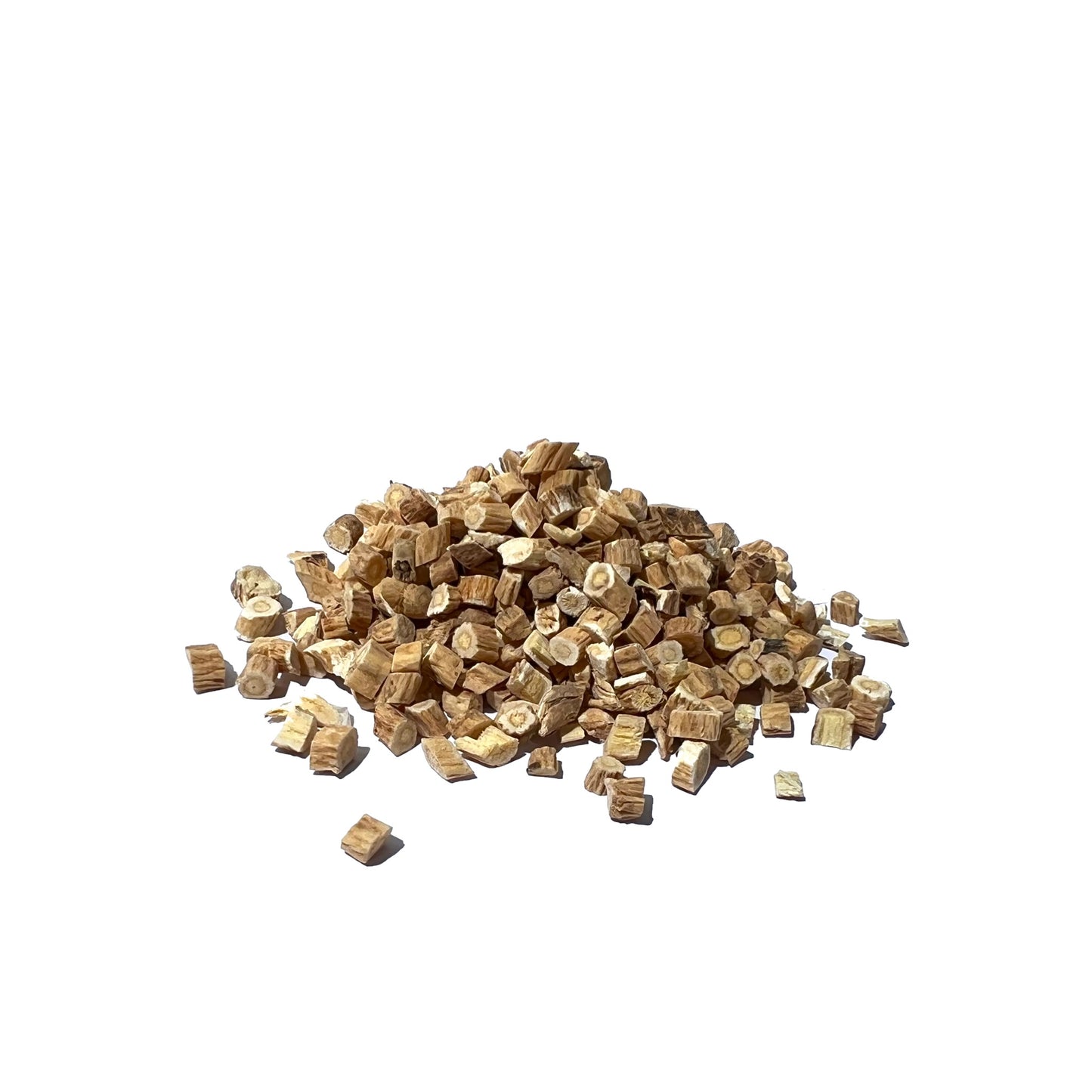 Slices of dried roots in brown tones on a white background