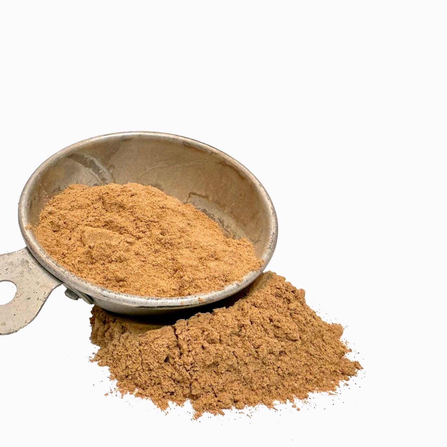Vintage metal measuring scoop with finely ground astragalus root powder