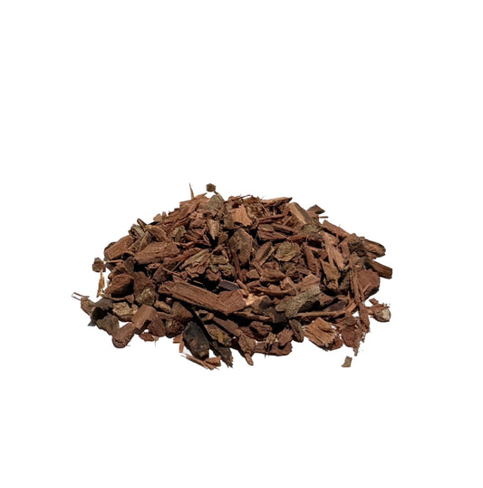 Mulch-like chips of brown bayberry tree bark in a small pile