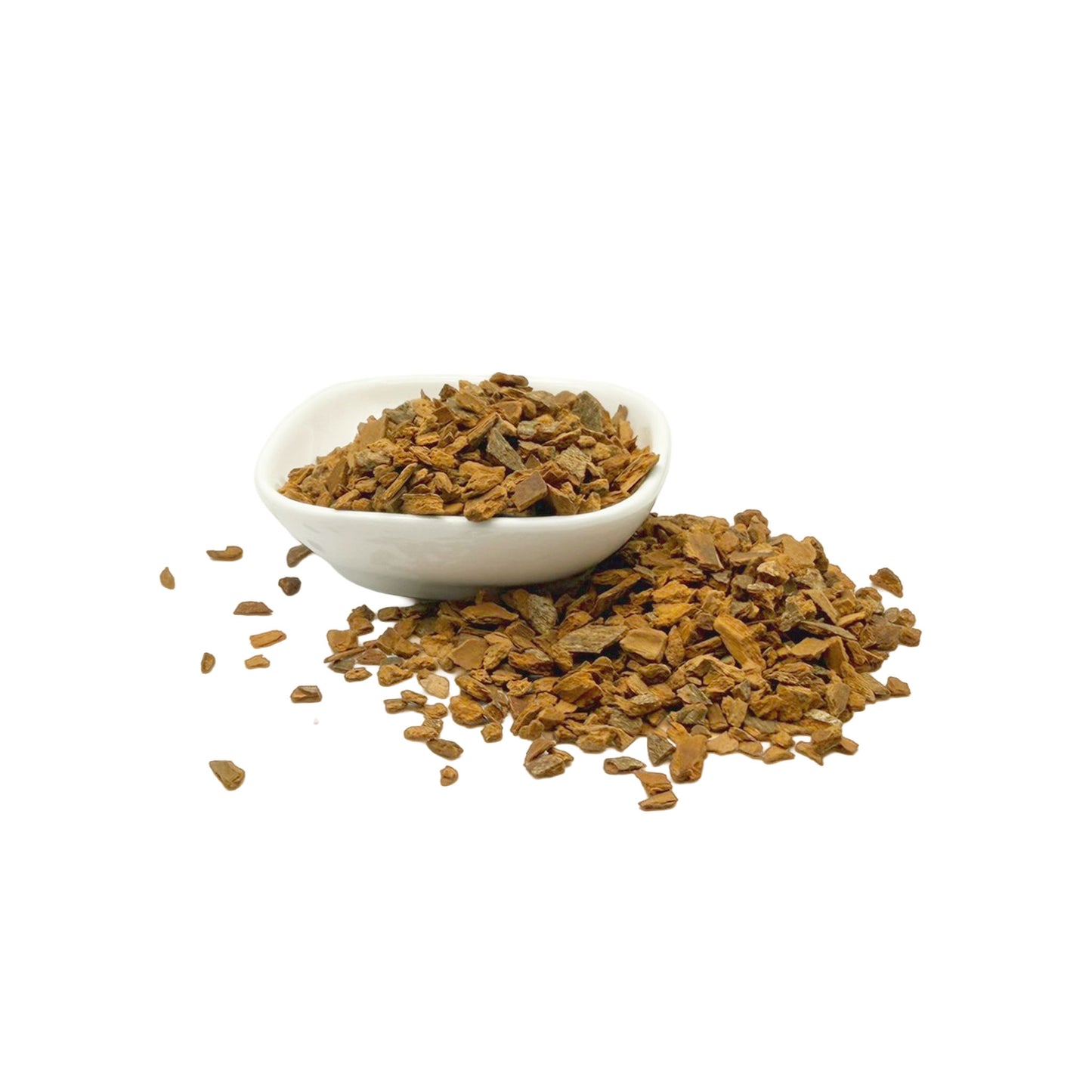 A small white bowl filled with and surrounded by loose, light brown cinnamon bark chips, photographed on a clean white background.