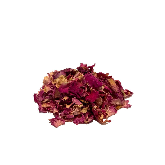 Large, deep pink dried rose petals in a small, tight pile
