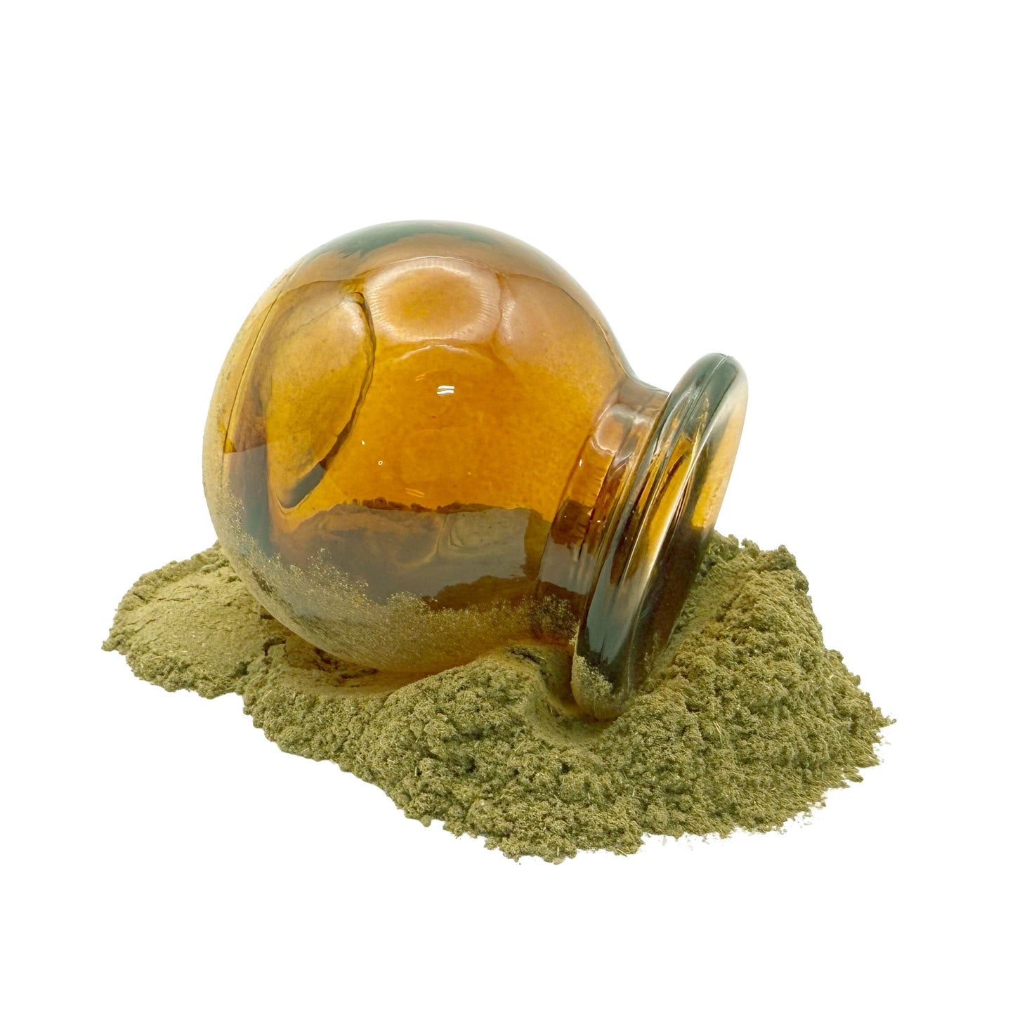An amber glass apothecary-style jar tipped on its side with a mound of greenish brown powder spilled out, photographed on a clean white background.