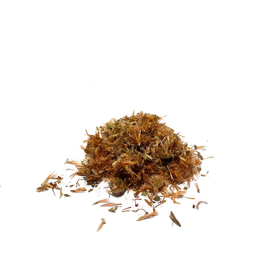 Golden yellow dried flowers and petals in a small pile