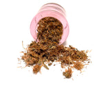 Small, round pink jar on its side, spilling dried flower parts