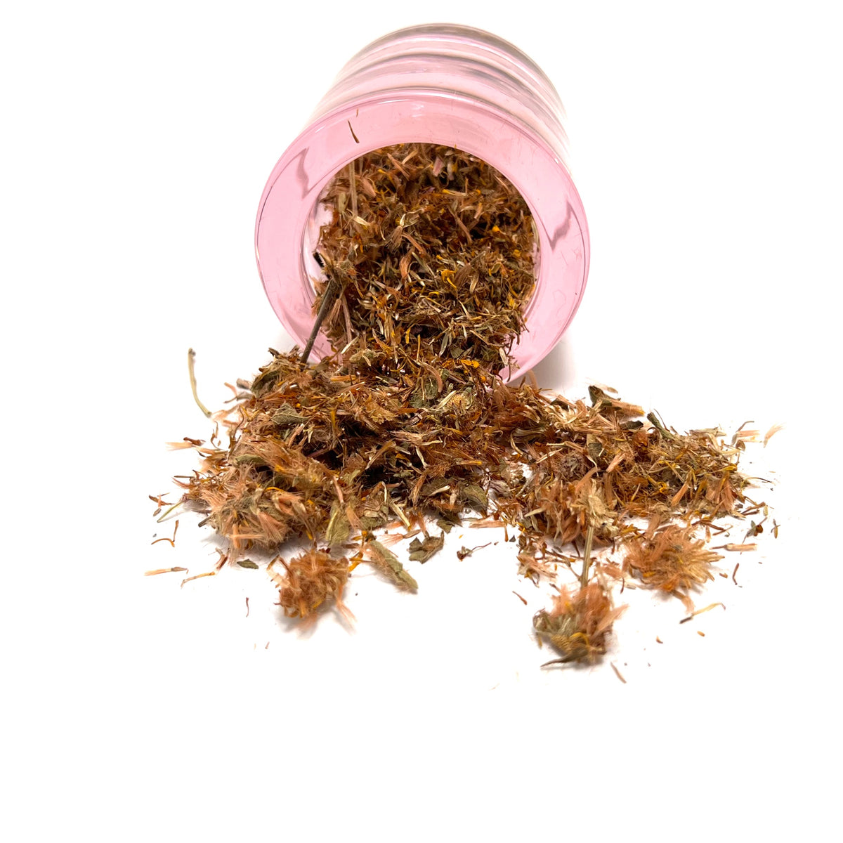 Small, round pink jar on its side, spilling dried flower parts