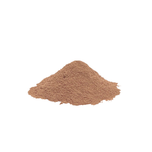 Finely ground beige powder piled on a white background