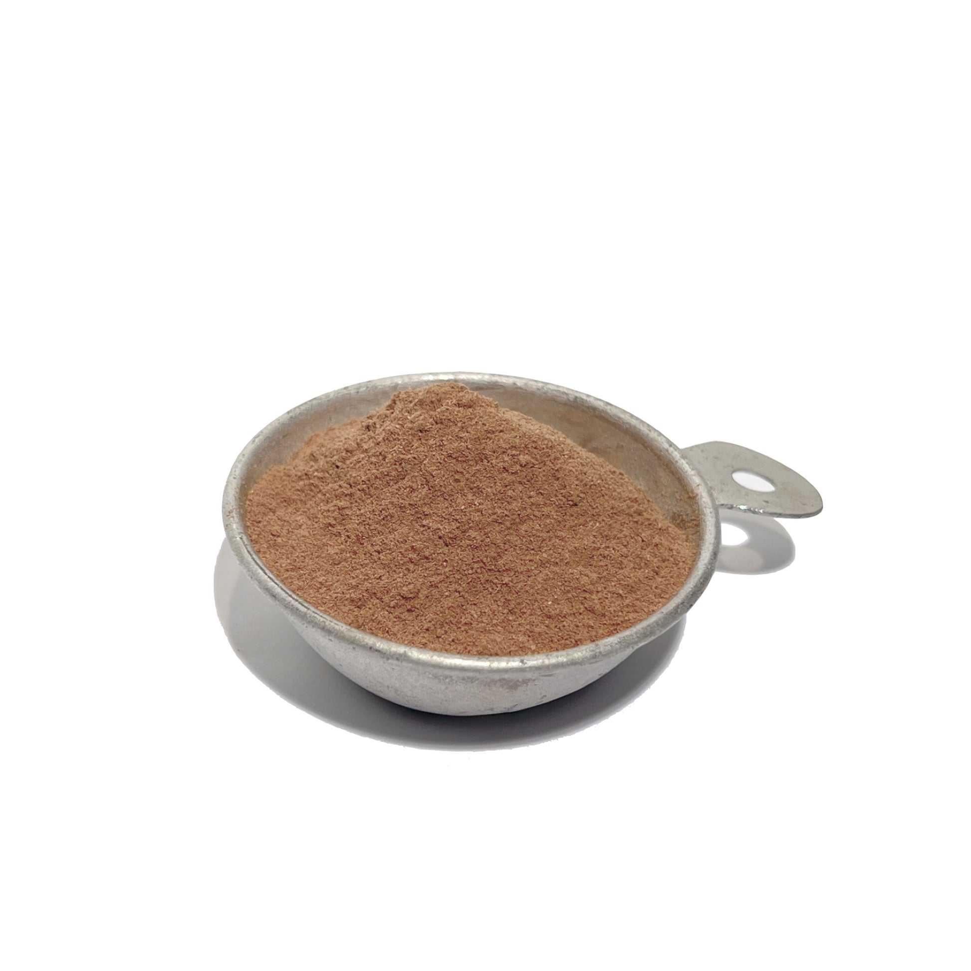Measuring tin rounded with bayberry root powder
