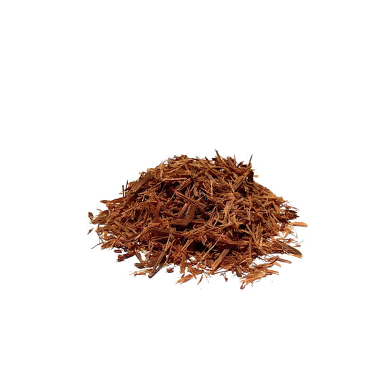 Piles of orange-brown cat’s claw bark chips