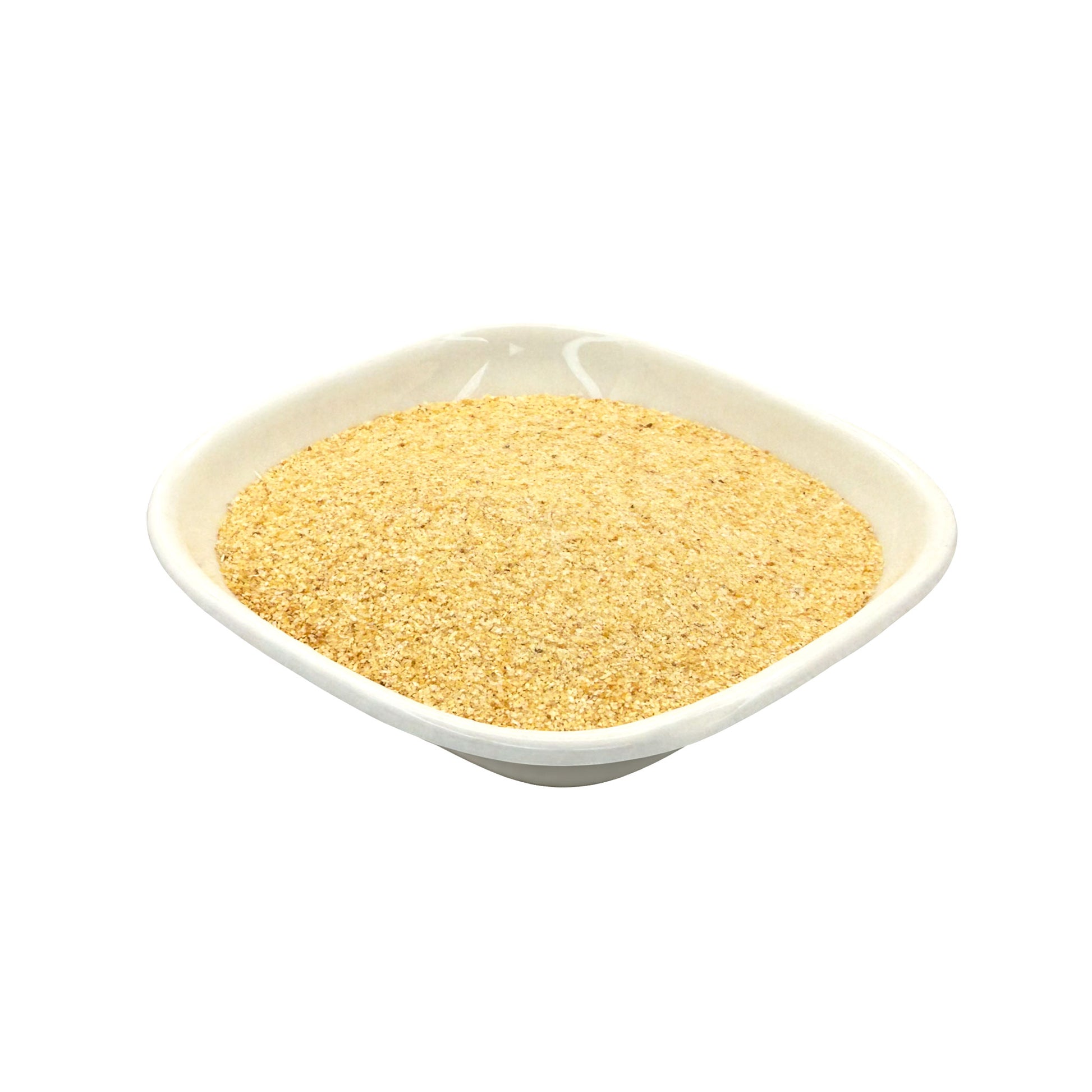 A mound of fine golden-yellow granulated garlic, presented in a small white square dish against a solid white background.