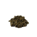Mound of dark green-brown dried and crumpled leaves
