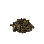 Mound of dark green-brown dried and crumpled leaves