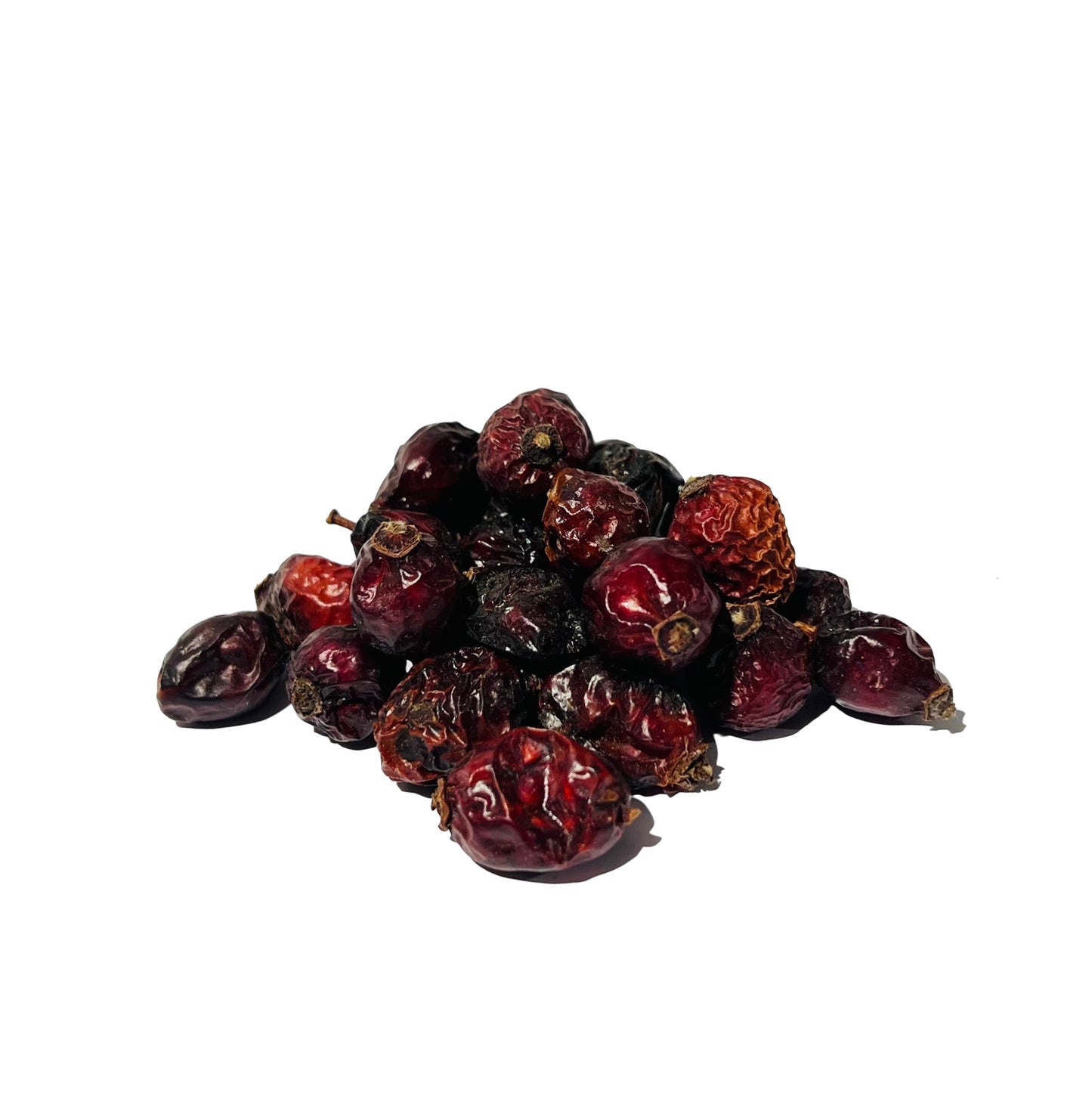Two dozen glossy, dark red and dimpled whole rose hips on a white background
