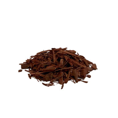 Pile of dark reddish brown yohimbe bark pieces