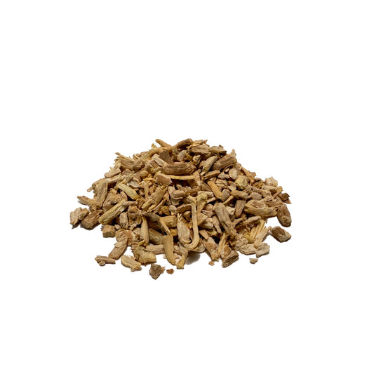 Small, broken up pieces of dried ashwagandha root in wood tones