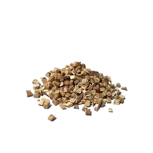 Slices of dried roots in brown tones on a white background