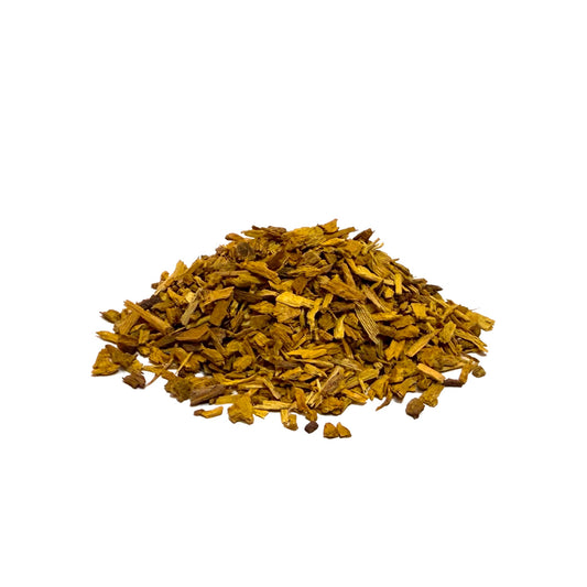 Pile of dried yellow barberry bark chips on a white background