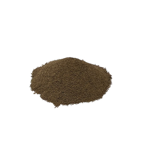 Ground black walnut leaves, piled on a white background