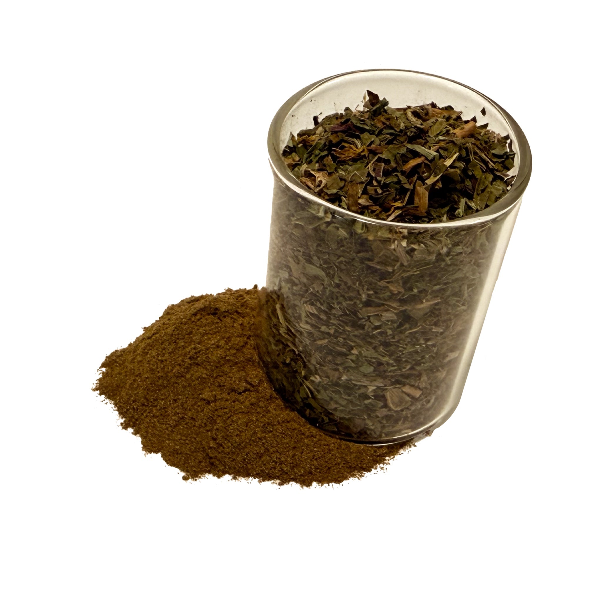 Medium brown dandelion leaf powder under a clear glass cup of greenish dandelion leaves.