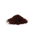 A small mound of dark brown elderberry powder on a plain white background.
