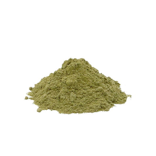 A small mound of fine grownish green powder centered on a plain white background.