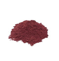 Dark purple-red hibiscus powder on a white background
