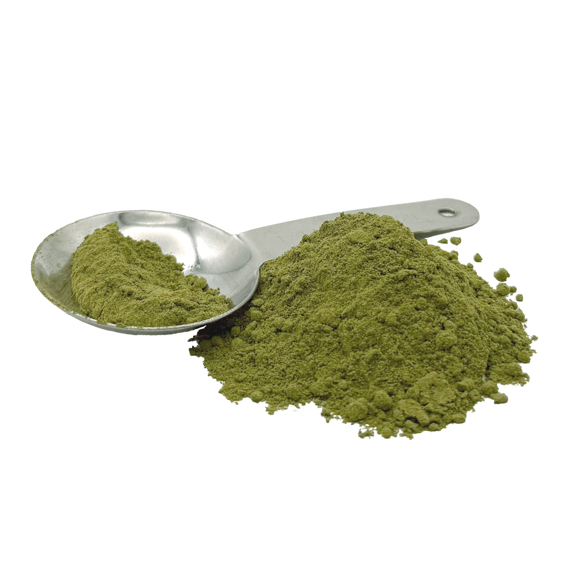 A pile of green kale powder with a metal spoon holding a scoop of the same powder, shown on a plain white background.