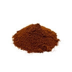 A small mound of fine reddish brown paprika powder photographed on a clean white background.