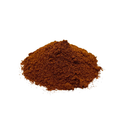 A small mound of fine reddish brown paprika powder photographed on a clean white background.