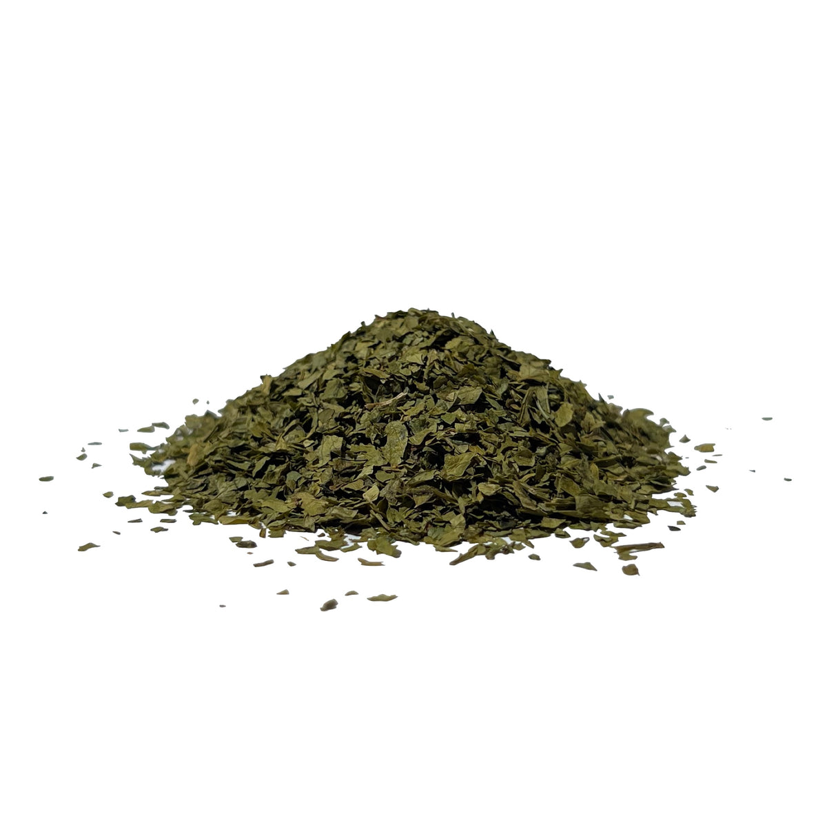 Deep green dried parsley flakes in a pile
