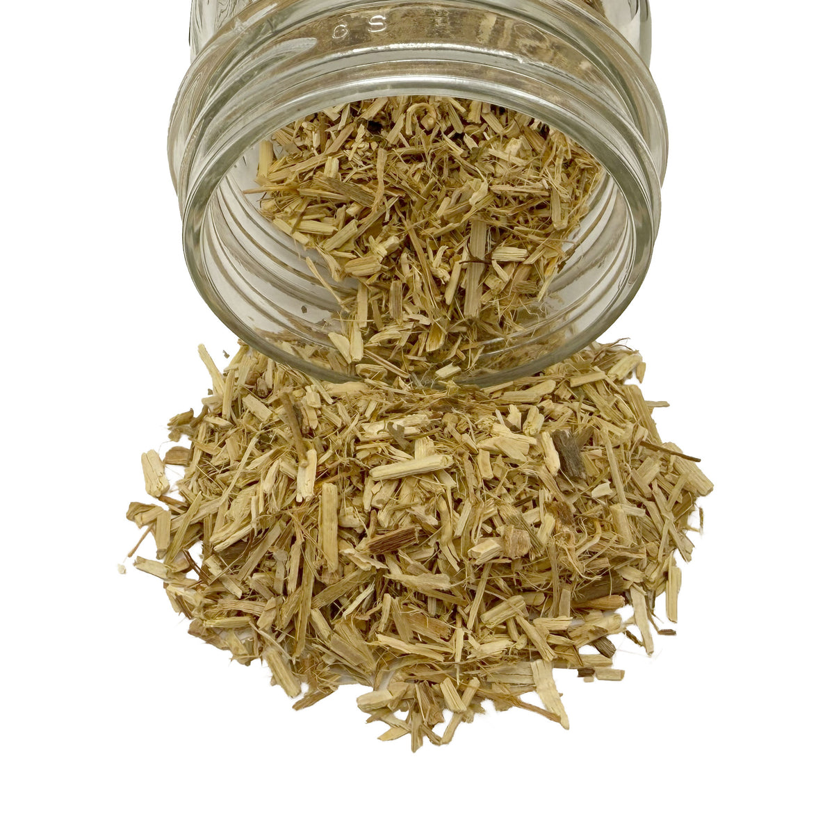 Dry cut and sifted passion flower herb spilling out of a clear glass jar against a solid white background.