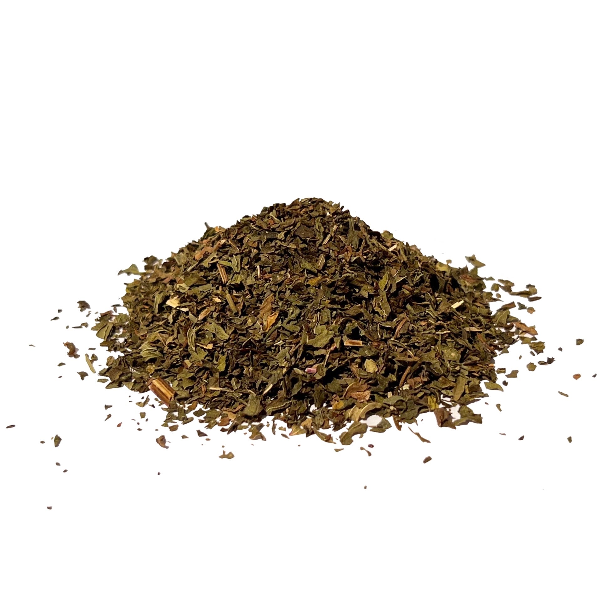 Flakes of dried peppermint leaf piled on a white background
