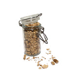 Glass spice jar overflowing with cut and sifted pleurisy root