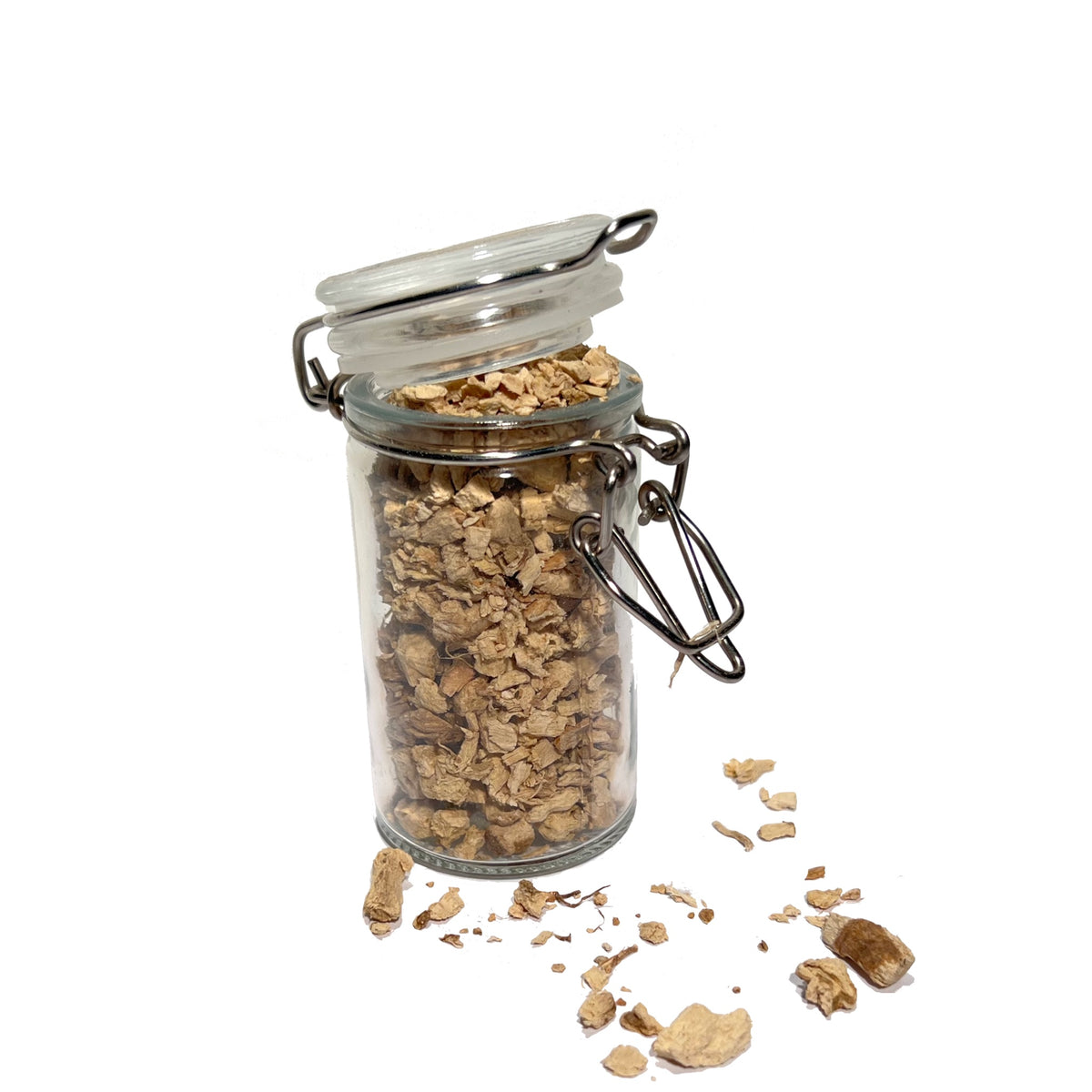 Glass spice jar overflowing with cut and sifted pleurisy root