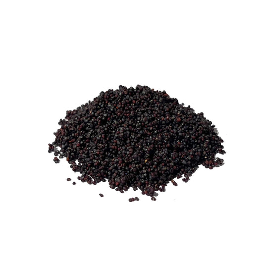 Pile of tiny blue-black poppy seeds on a white background