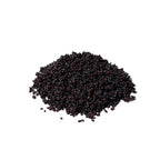 Pile of tiny blue-black poppy seeds on a white background