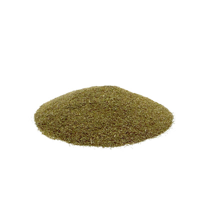 A small mound of fine brownish-green leaf powder centered on a plain white background.