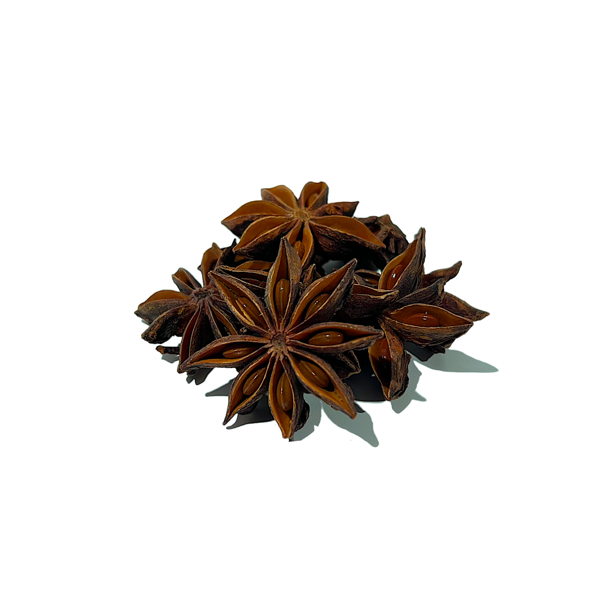 Cluster of a half dozen reddish-brown star anise seedpods