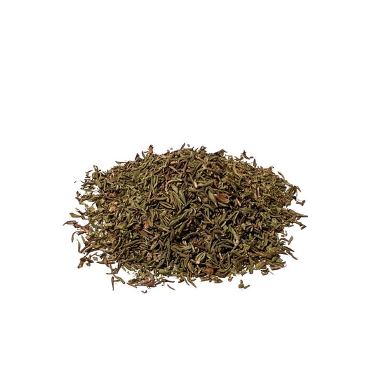 Pile of tiny, dark green dried leaves on a white background