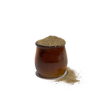 Vintage brown glass jar overflowing with wild lettuce powder